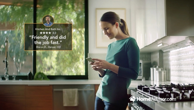 homeadvisor review, lady standing in kitchen on her phone